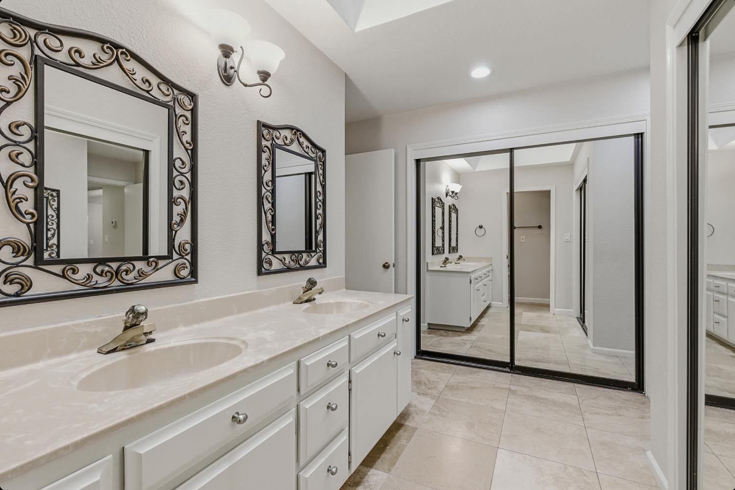 1175 Rose Tree Way Sacramento, CA 95831 - Photo 20 of 33 a spacious bathroom with a double vanity sink mirror and next to a window