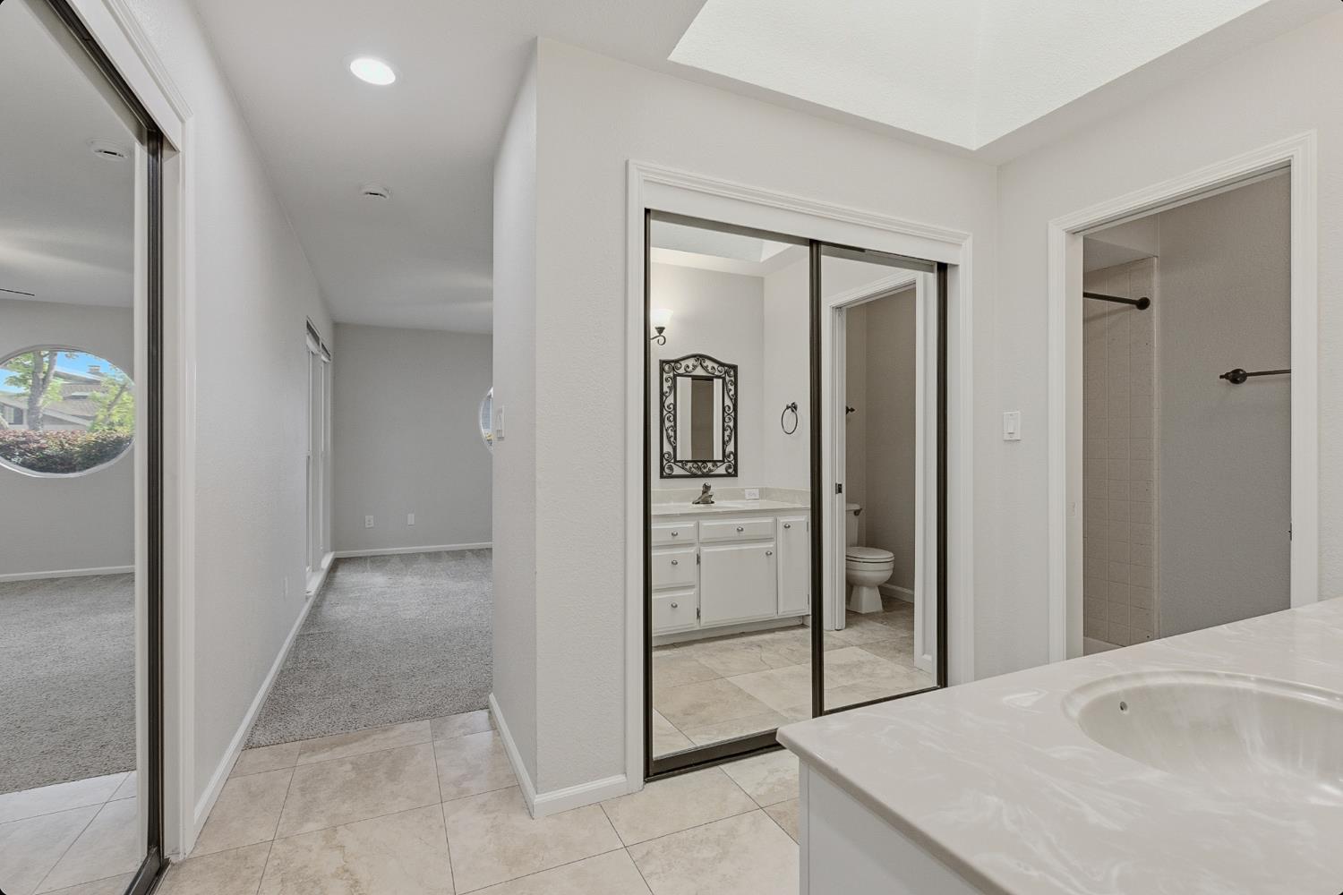 1175 Rose Tree Way Sacramento, CA 95831 - Photo 22 of 33 a view of a bathroom from the hallway