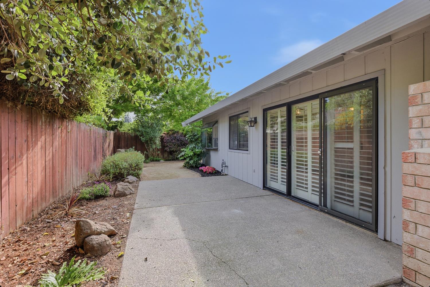 1175 Rose Tree Way Sacramento, CA 95831 - Photo 32 of 33 a view of a house with backyard and plants