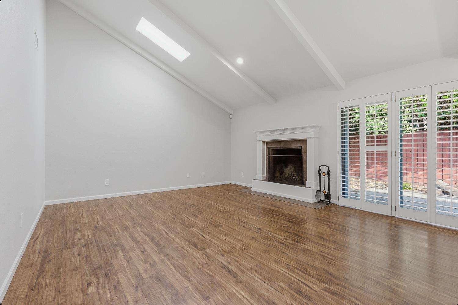 1175 Rose Tree Way Sacramento, CA 95831 - Photo 5 of 33 wooden floor fireplace and natural light in room