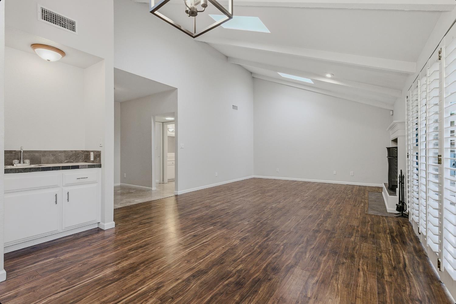1175 Rose Tree Way Sacramento, CA 95831 - Photo 7 of 33 a view of empty room with wooden floor