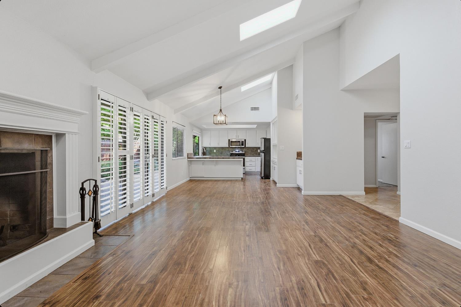 1175 Rose Tree Way Sacramento, CA 95831 - Photo 9 of 33 a view of empty room with wooden floor and fireplace