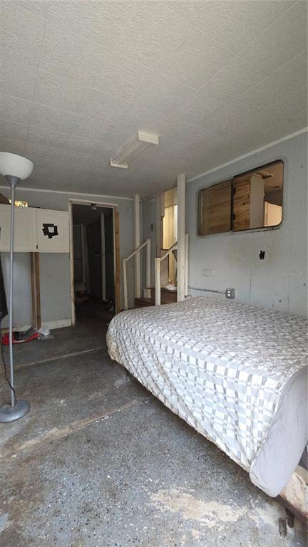 3000 Clarcona Road, Unit 510 Apopka, FL 32703 - Photo 2 of 8 a bedroom with a bed and window