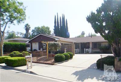 713 Appleton Road Simi Valley, CA 93065 - Photo 1 of 20 a view of a house with a yard and potted plants