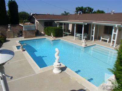 713 Appleton Road Simi Valley, CA 93065 - Photo 2 of 20 a view of a house with swimming pool and porch