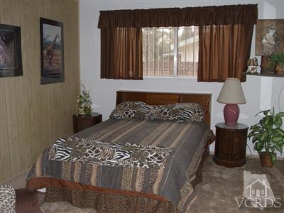 713 Appleton Road Simi Valley, CA 93065 - Photo 17 of 20 a bed sitting in a bedroom next to a window
