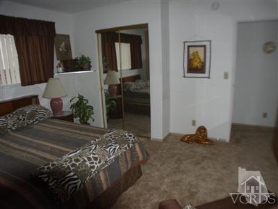 713 Appleton Road Simi Valley, CA 93065 - Photo 18 of 20 a bedroom with a bed and a window
