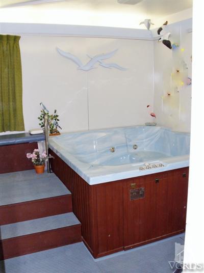 713 Appleton Road Simi Valley, CA 93065 - Photo 4 of 20 a bathroom with a sink and a mirror