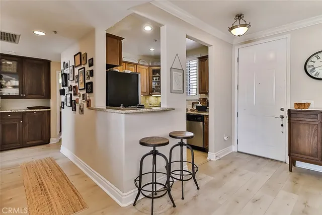 a kitchen with stainless steel appliances a refrigerator and a stove top oven