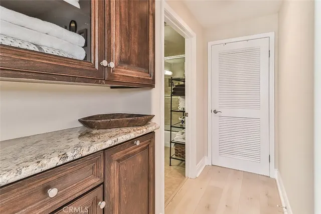 a kitchen with granite countertop cabinets and white appliances