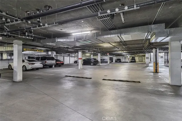 a view of parking garage with cars