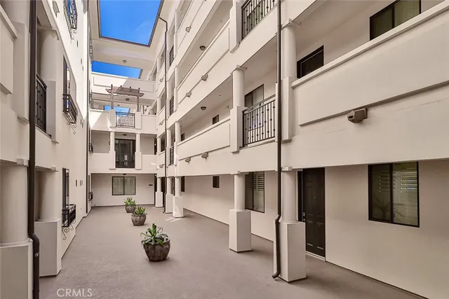 a view of a building with sitting area