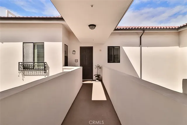 a view of a hallway with windows