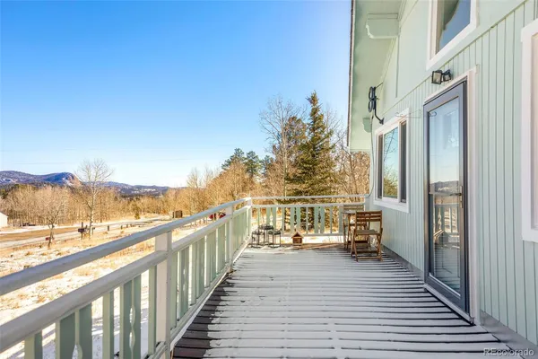 a view of a balcony with wooden floor