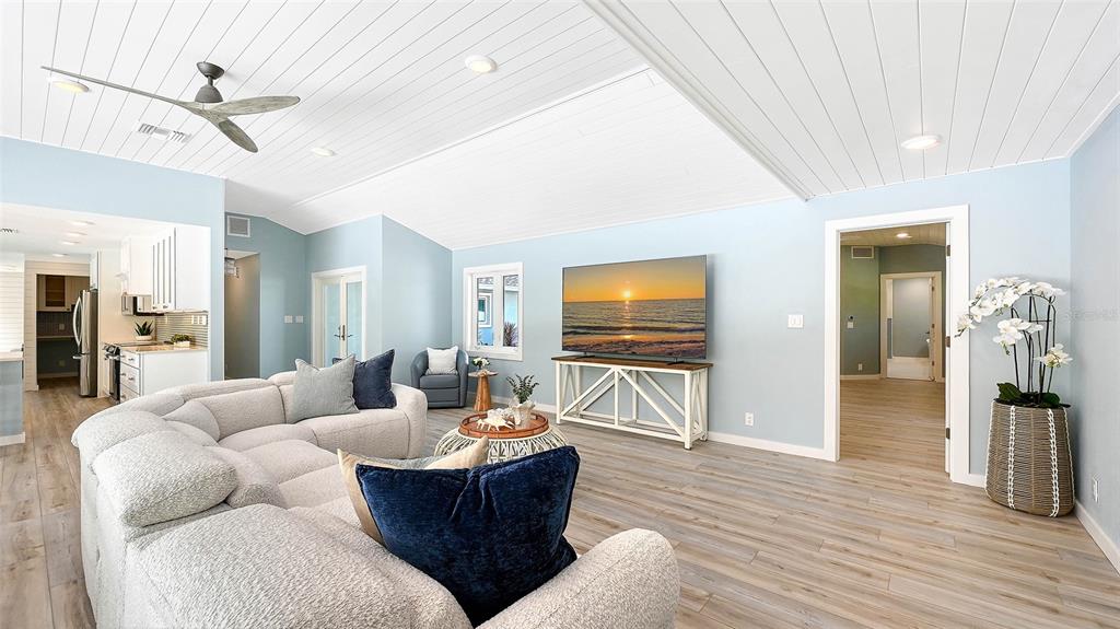 7221 Plovers Way Sarasota, FL 34242 - Photo 13 of 100 a living room with furniture and a wooden floor