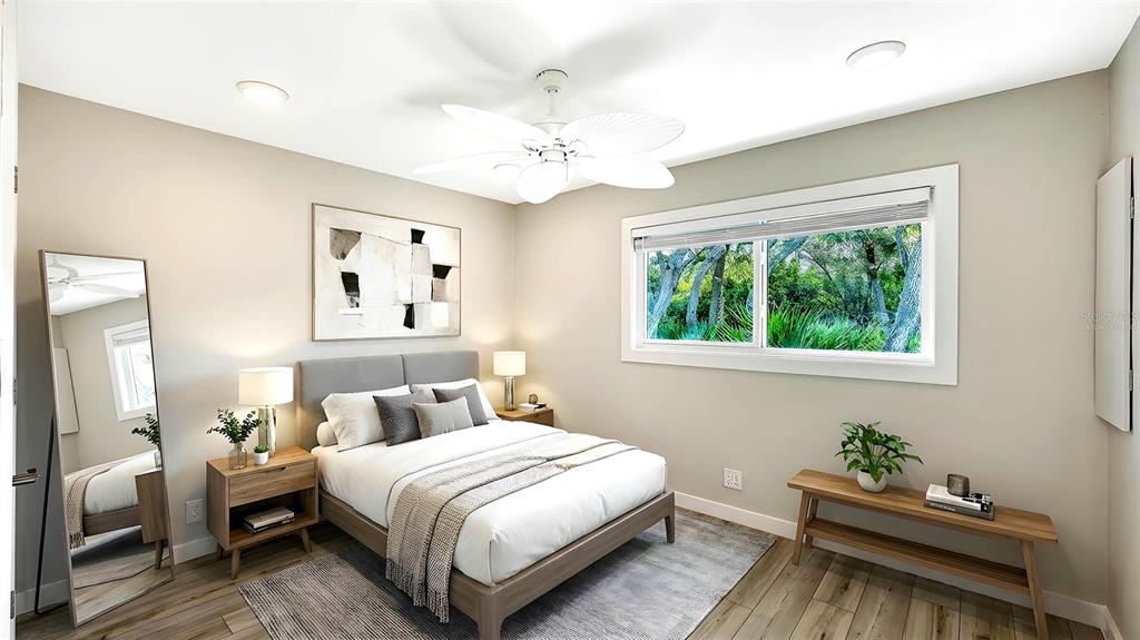 7221 Plovers Way Sarasota, FL 34242 - Photo 34 of 100 a bedroom with a bed and window