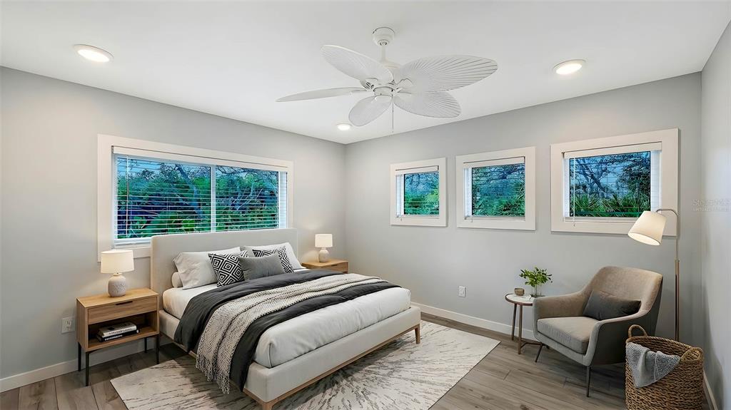 7221 Plovers Way Sarasota, FL 34242 - Photo 39 of 100 a bedroom with a bed and a window