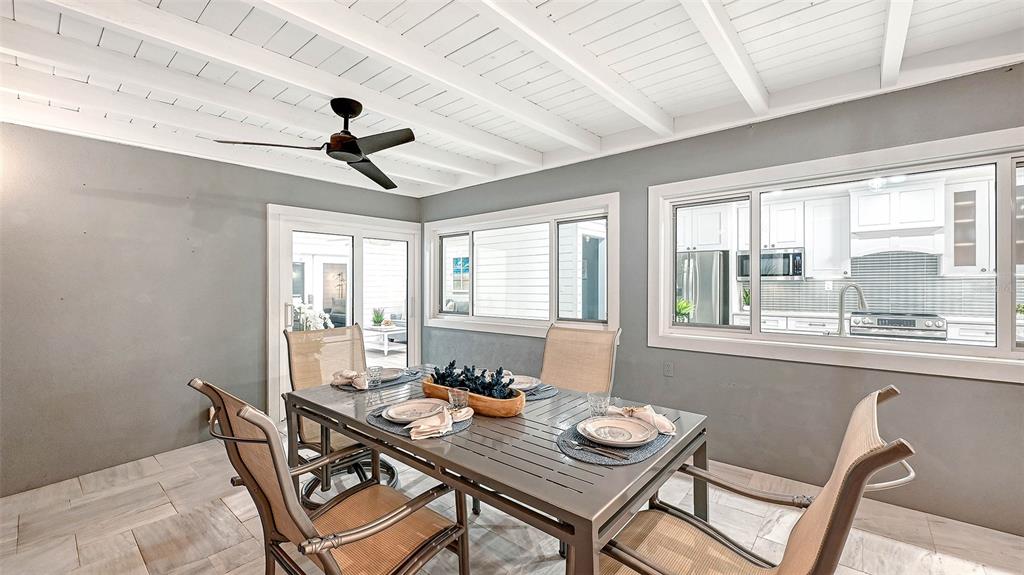 7221 Plovers Way Sarasota, FL 34242 - Photo 46 of 100 a view of a dining room with furniture window and outside view