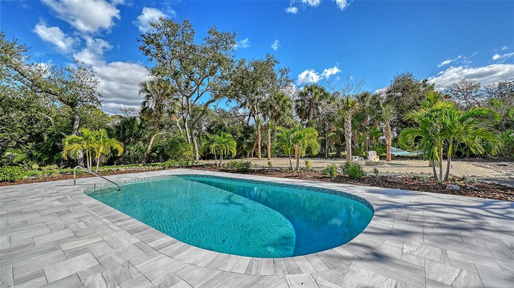 7221 Plovers Way Sarasota, FL 34242 - Photo 51 of 100 a view of a swimming pool with a yard