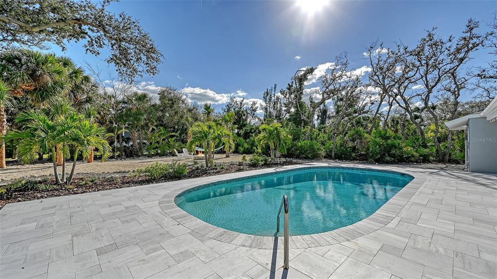 7221 Plovers Way Sarasota, FL 34242 - Photo 52 of 100 a view of a swimming pool with an outdoor space