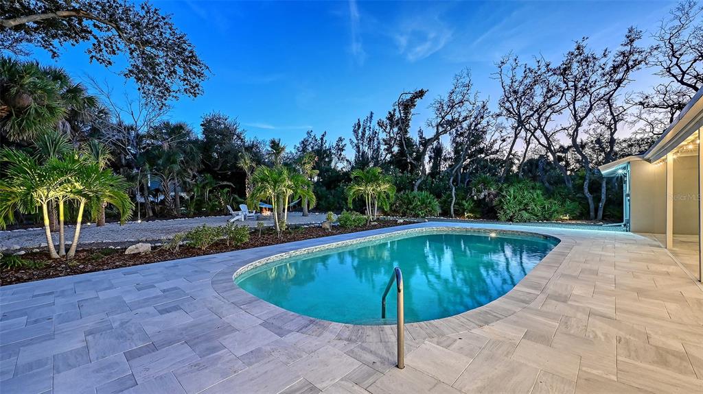 7221 Plovers Way Sarasota, FL 34242 - Photo 67 of 100 a view of a swimming pool with a yard