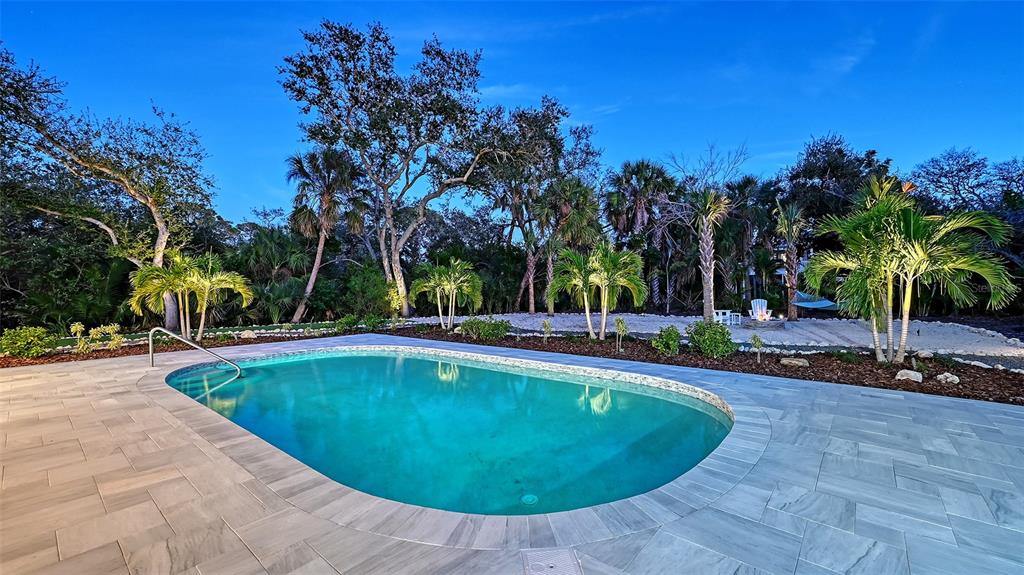 7221 Plovers Way Sarasota, FL 34242 - Photo 68 of 100 a view of a swimming pool with a patio