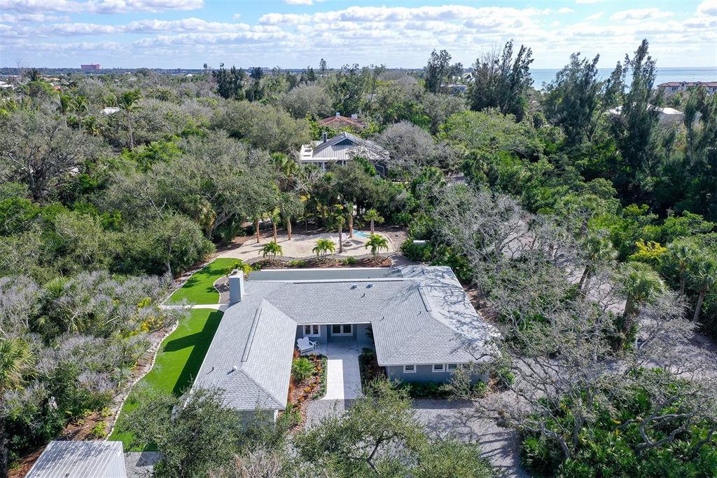 7221 Plovers Way Sarasota, FL 34242 - Photo 7 of 100 an aerial view of a house with a yard