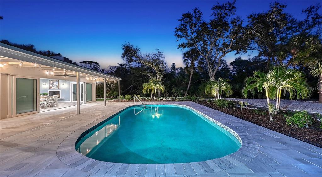 7221 Plovers Way Sarasota, FL 34242 - Photo 76 of 100 a view of outdoor space yard swimming pool and patio
