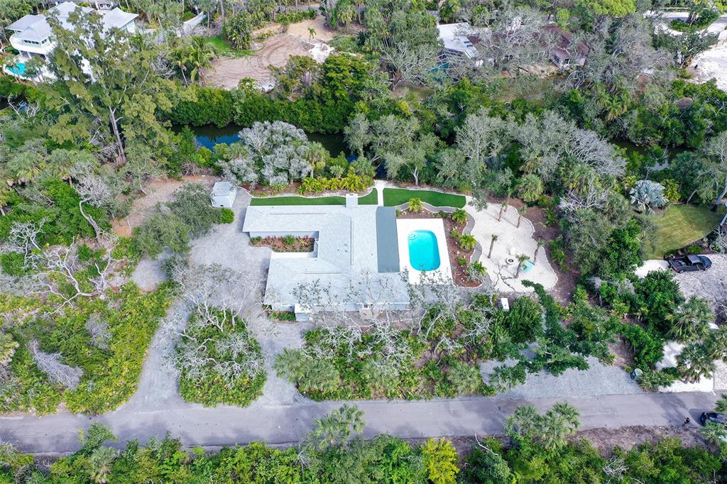 7221 Plovers Way Sarasota, FL 34242 - Photo 80 of 100 an aerial view of a house with a swimming pool