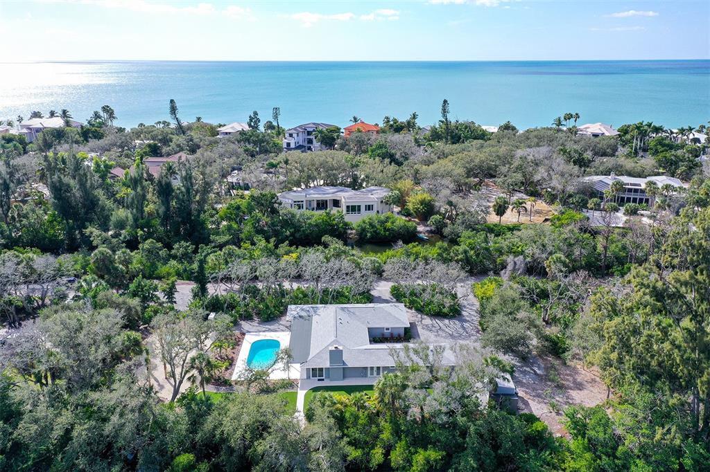 7221 Plovers Way Sarasota, FL 34242 - Photo 83 of 100 an aerial view of a house with a garden