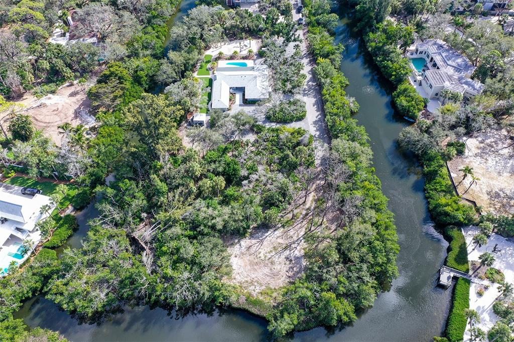 7221 Plovers Way Sarasota, FL 34242 - Photo 86 of 100 an aerial view of a house with a yard and garden