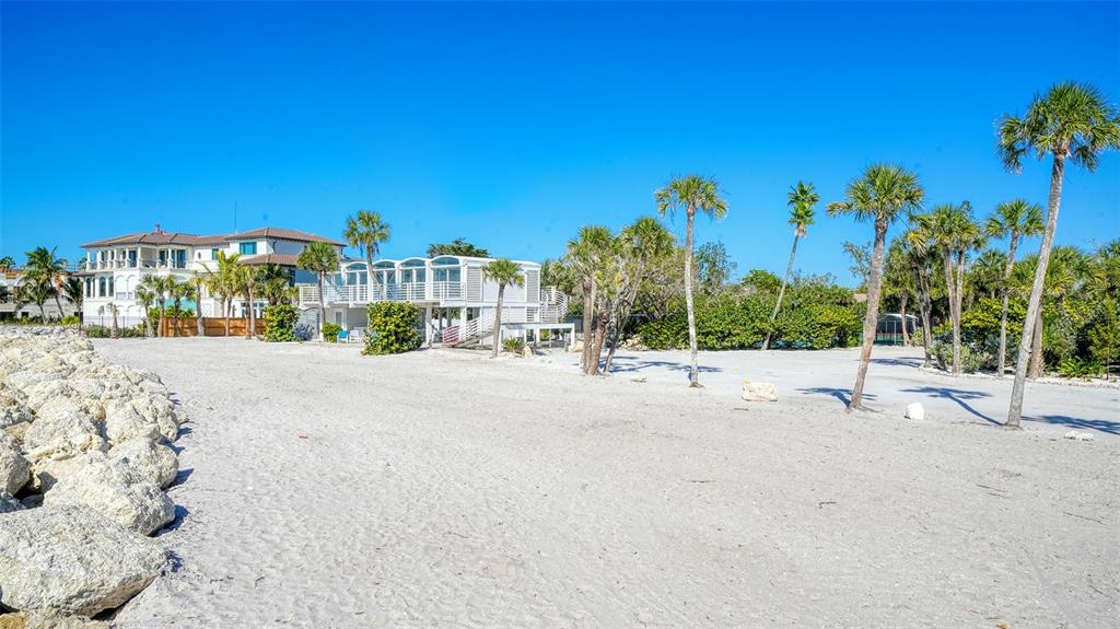 7221 Plovers Way Sarasota, FL 34242 - Photo 95 of 100 a view of a street with a building in the background