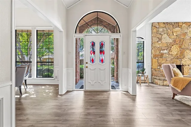 a view of room with furniture and wooden floor