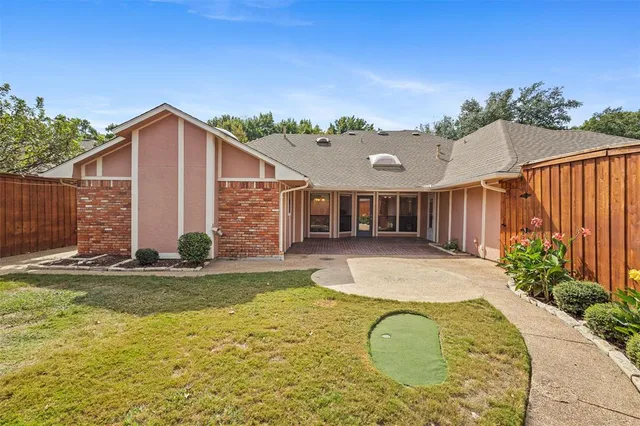 a view of swimming pool with a backyard