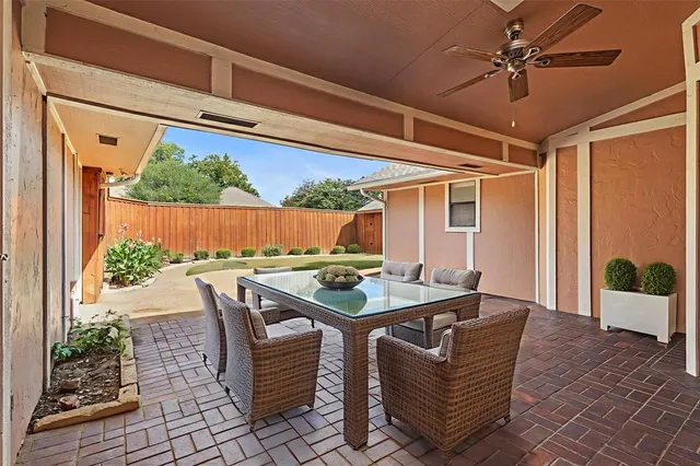 a dining room with a table and chairs
