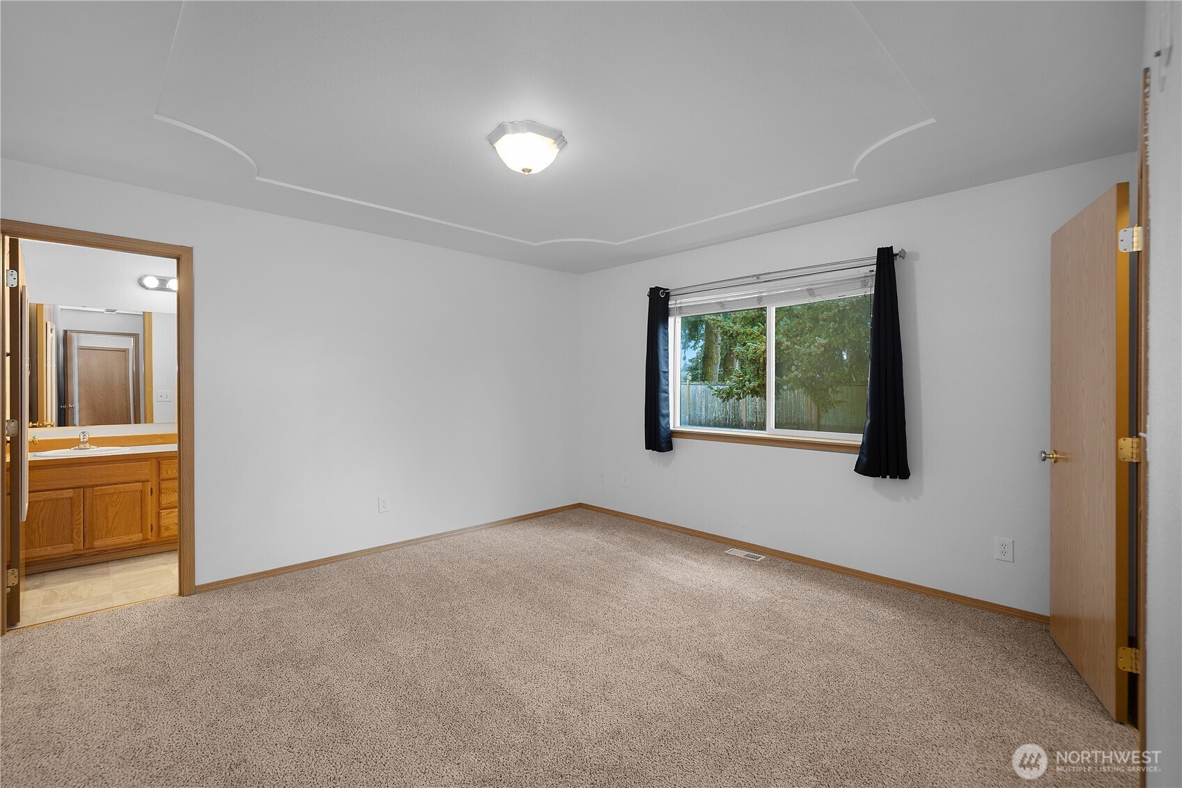 7606 187th Avenue Southwest Rochester, WA 98579 - Photo 14 of 28 an empty room with windows