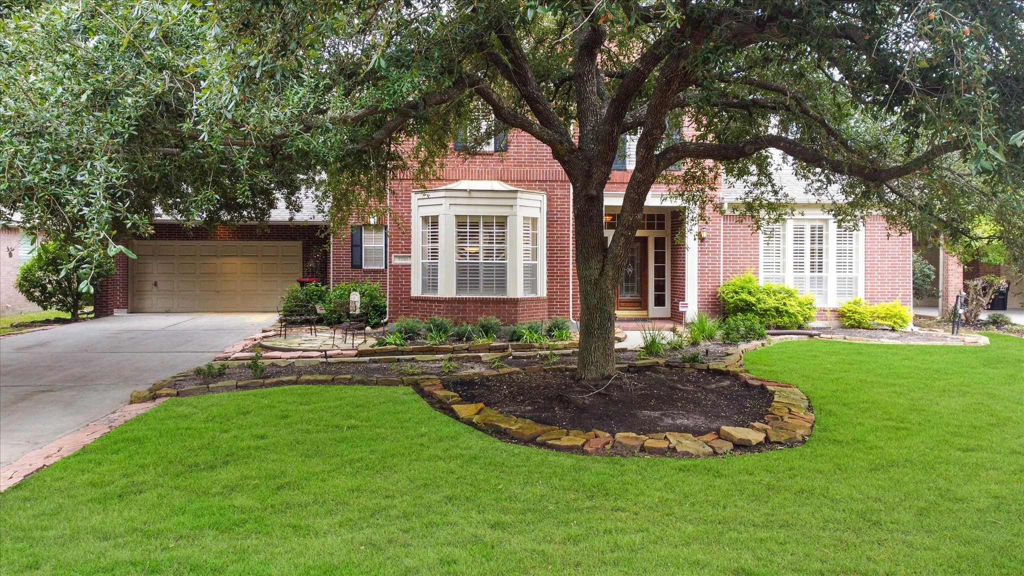 5718 Oakmoss Trail Spring, TX 77379 - Photo 2 of 48 a view of a house with a yard and tree s