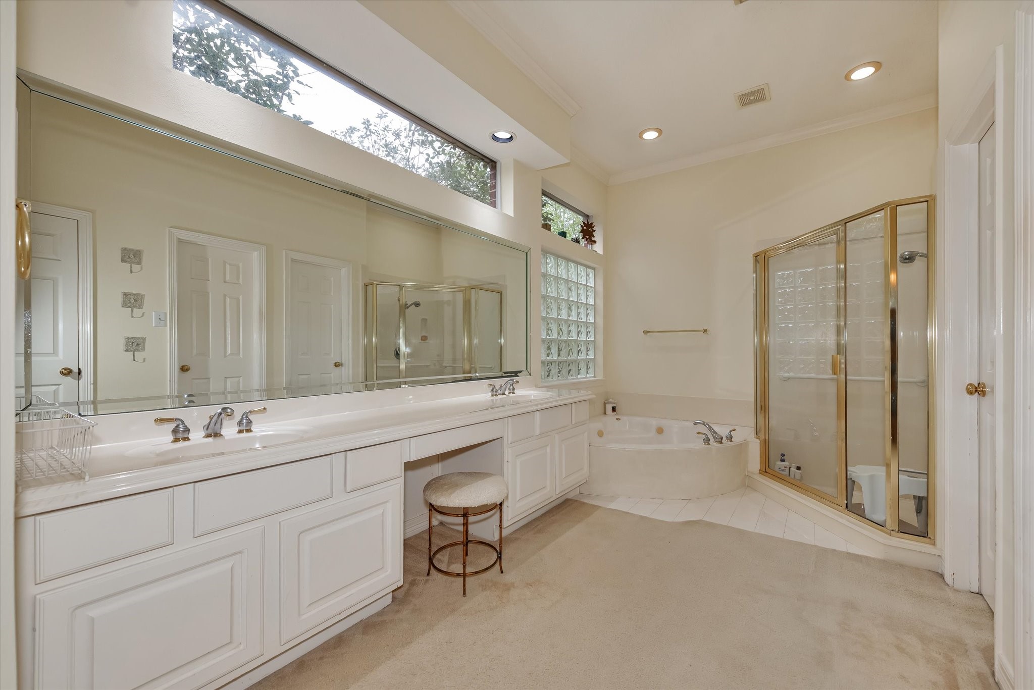 5718 Oakmoss Trail Spring, TX 77379 - Photo 24 of 48 a spacious bathroom with a shower a sink and mirror