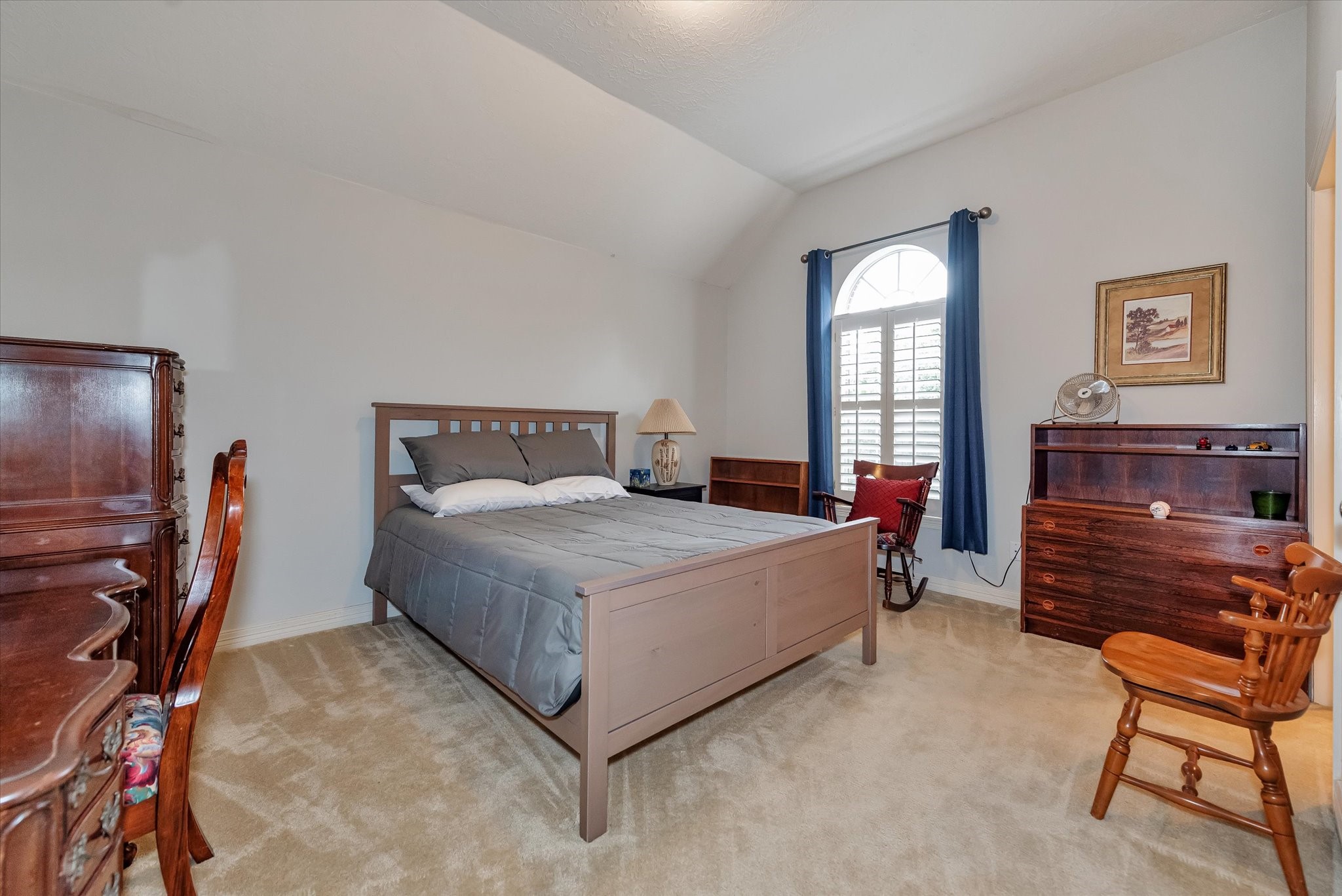 5718 Oakmoss Trail Spring, TX 77379 - Photo 34 of 48 a bedroom with a bed and a chair