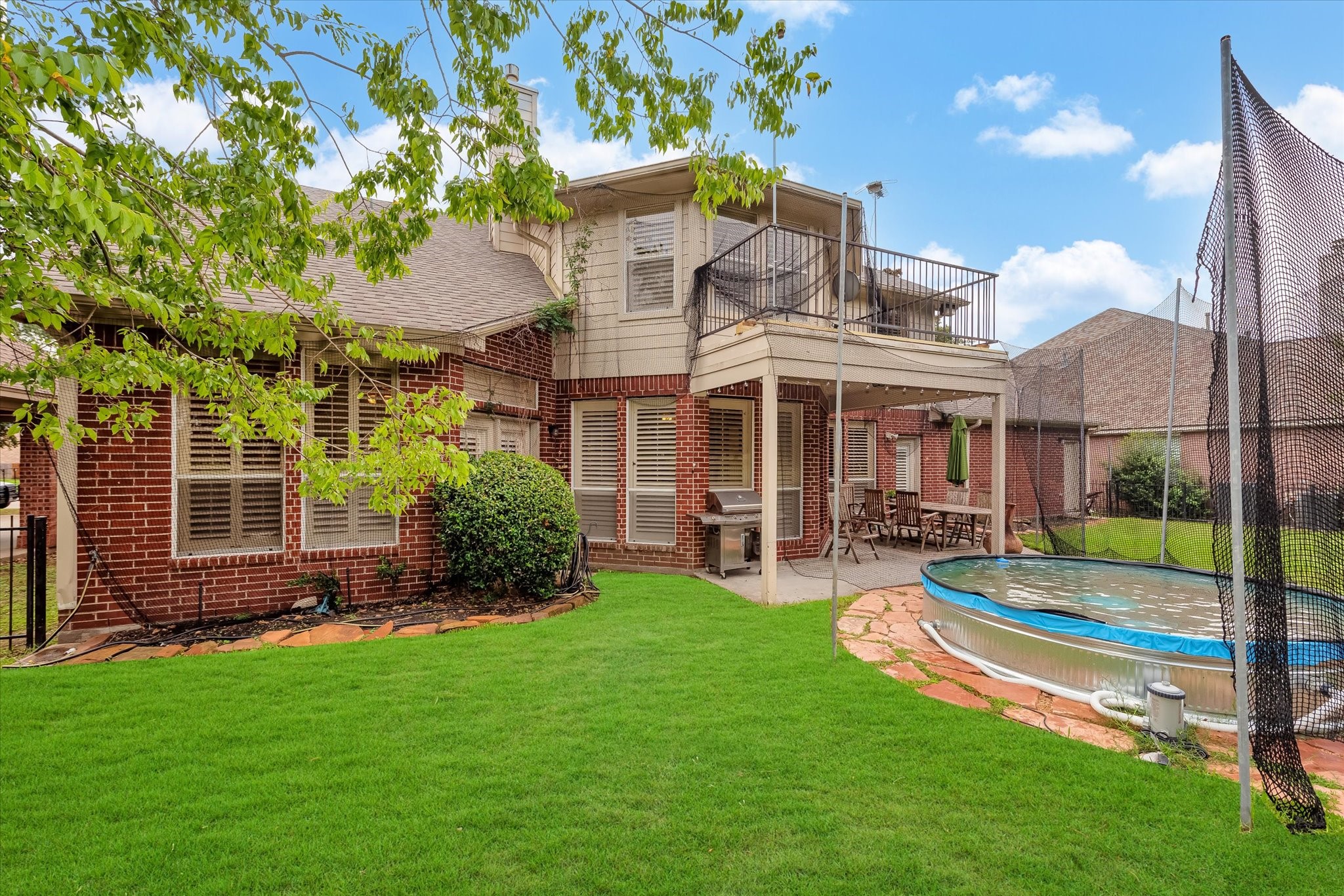 5718 Oakmoss Trail Spring, TX 77379 - Photo 40 of 48 a view of a house with a yard and sitting area