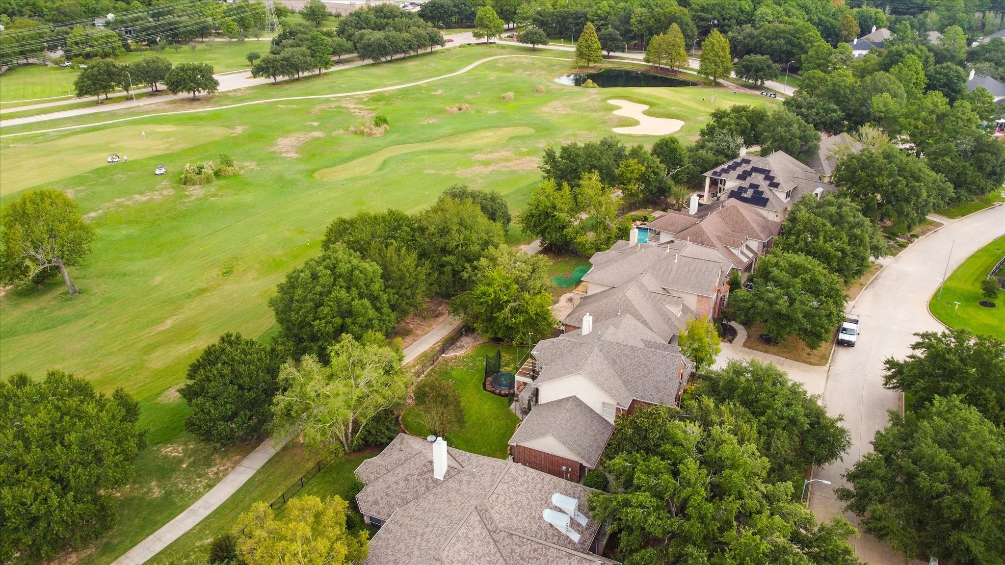 5718 Oakmoss Trail Spring, TX 77379 - Photo 44 of 48 an aerial view of residential houses with outdoor space and swimming pool