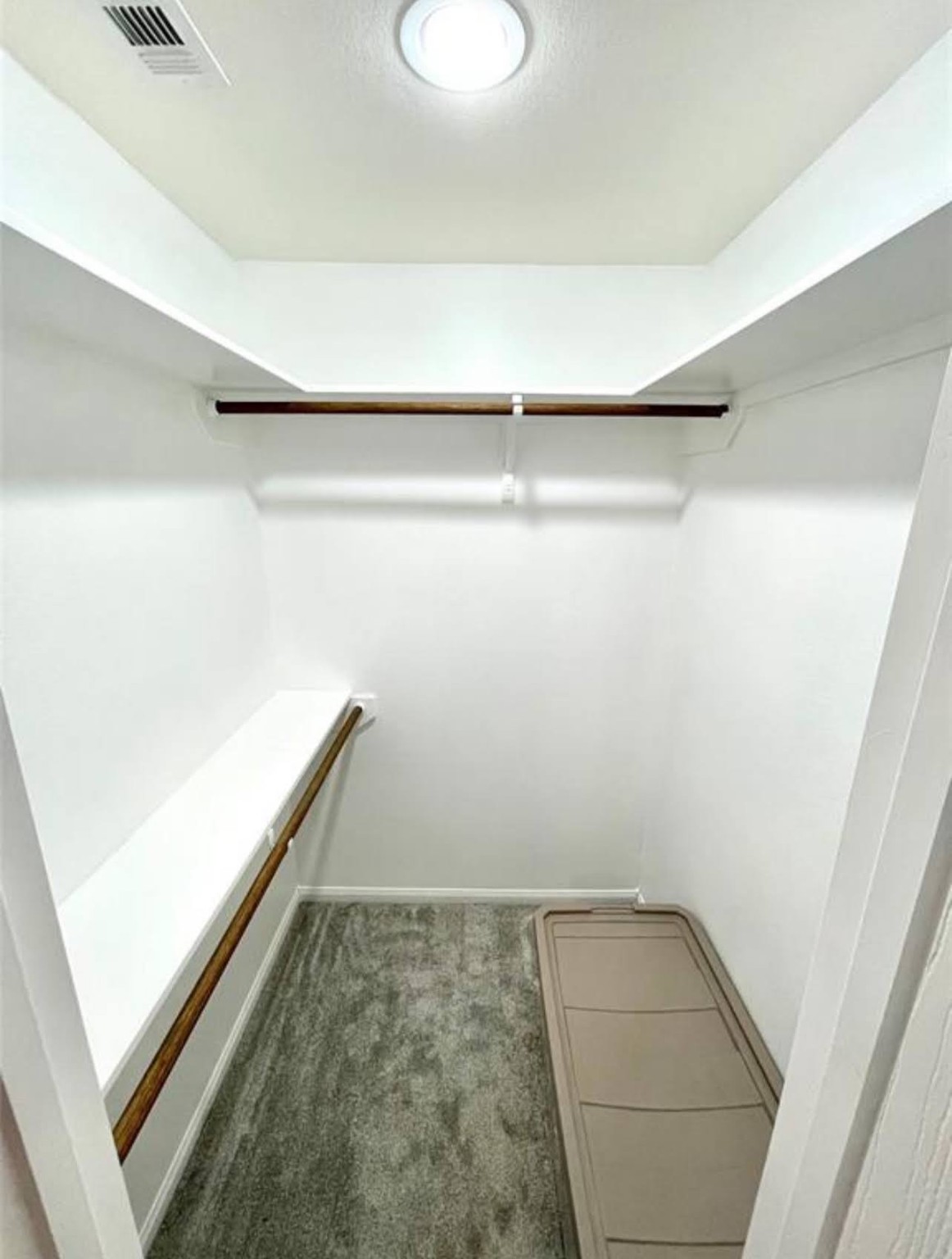 1811 Tickner Street Conroe, TX 77301 - Photo 15 of 20 a view of walk in closet with clothes