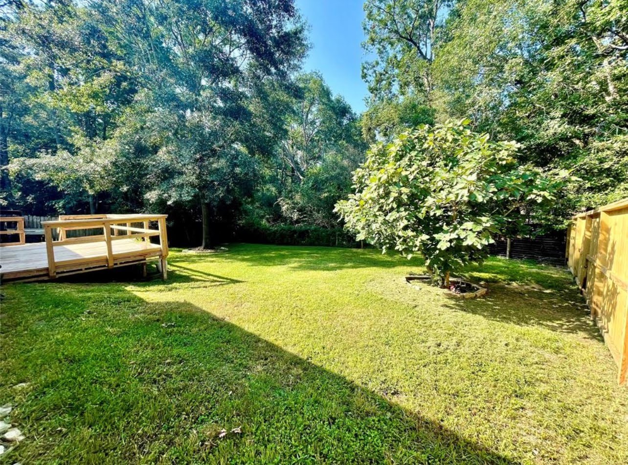 1811 Tickner Street Conroe, TX 77301 - Photo 18 of 20 a view of a backyard with swimming pool