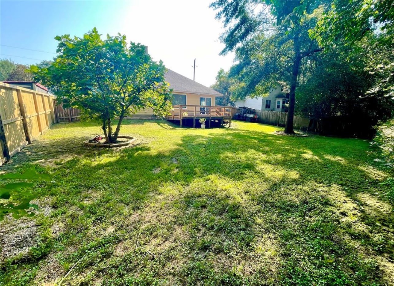 1811 Tickner Street Conroe, TX 77301 - Photo 20 of 20 a house view with a swimming pool