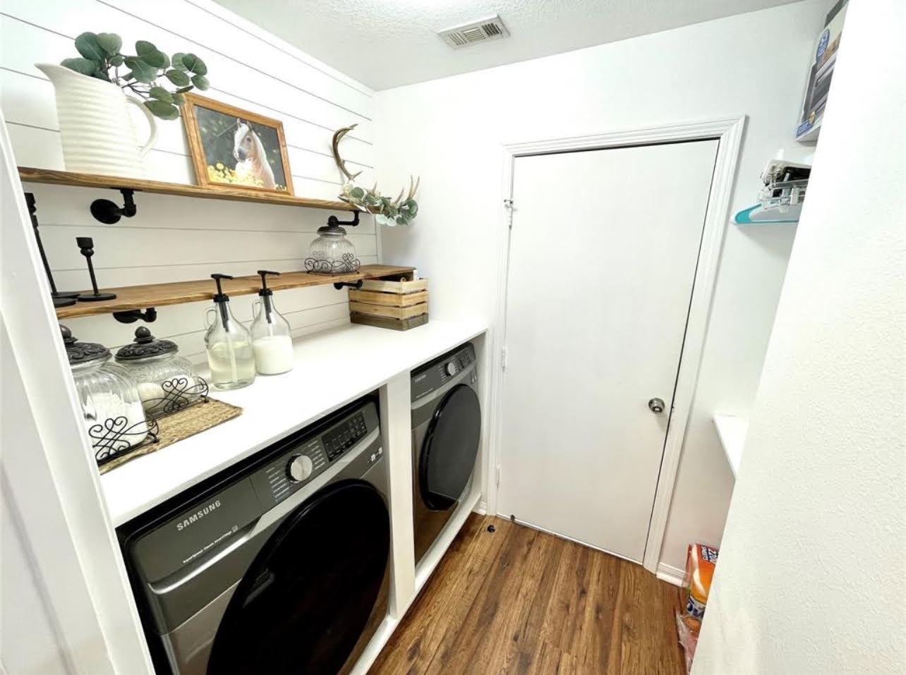 1811 Tickner Street Conroe, TX 77301 - Photo 7 of 20 a bathroom with a sink a mirror and shower