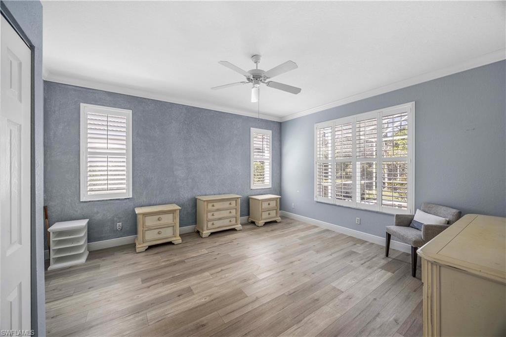 3589 Periwinkle Way Naples, FL 34114 - Photo 13 of 39 a living room with furniture and a window