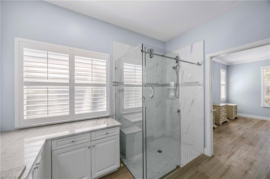 3589 Periwinkle Way Naples, FL 34114 - Photo 15 of 39 a bathroom with a shower and a sink