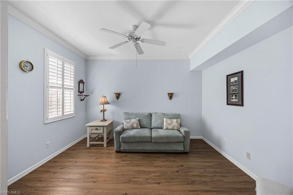 3589 Periwinkle Way Naples, FL 34114 - Photo 17 of 39 a living room with furniture and a window