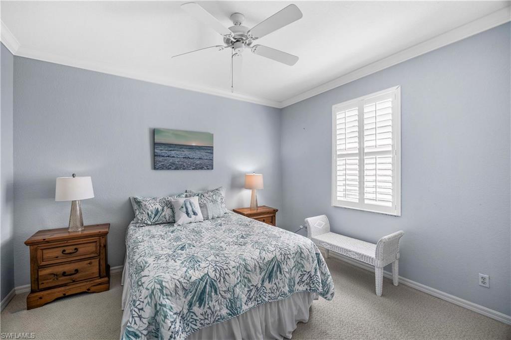 3589 Periwinkle Way Naples, FL 34114 - Photo 18 of 39 a bedroom with a bed and a window