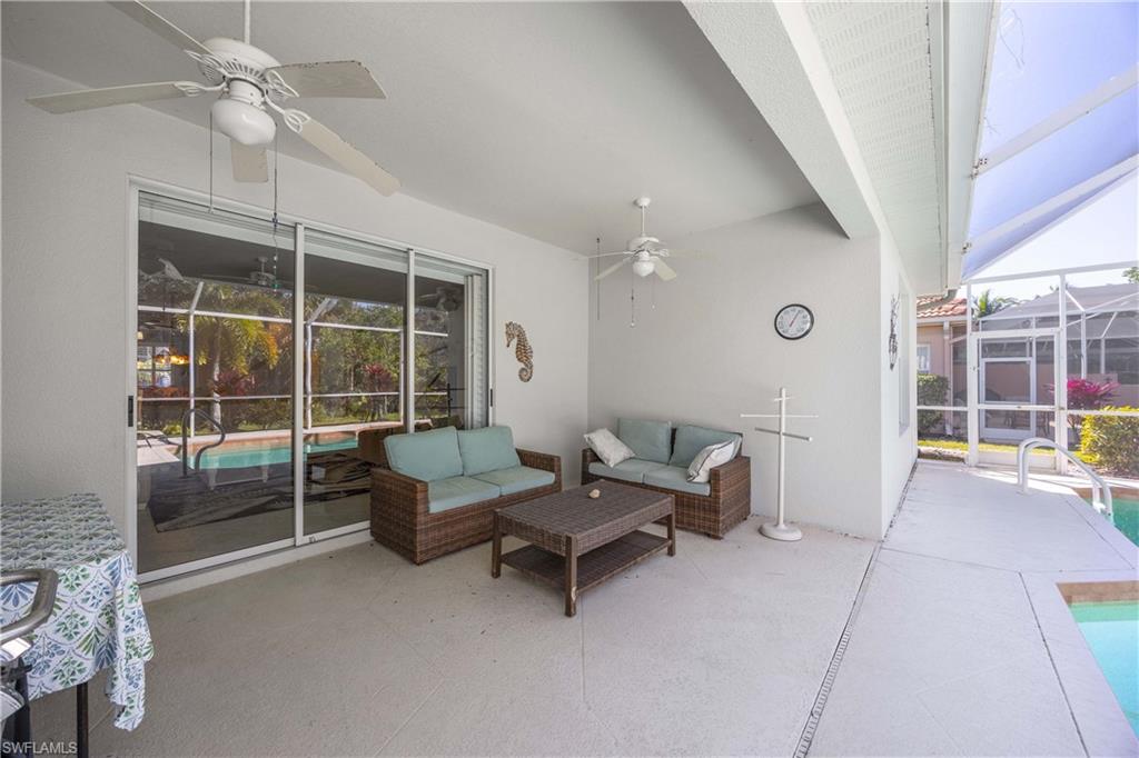 3589 Periwinkle Way Naples, FL 34114 - Photo 22 of 39 a living room with furniture and windows